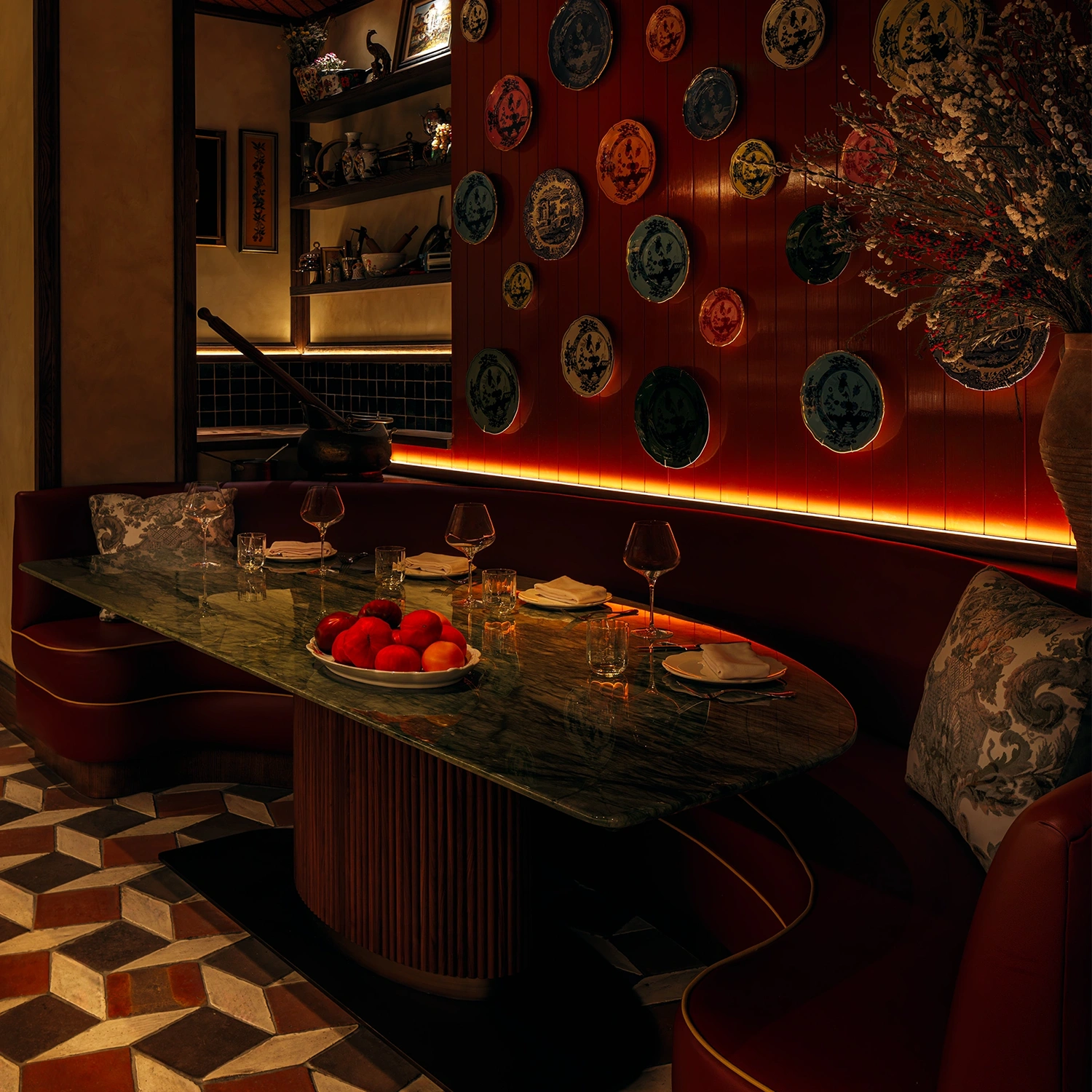Marble topped table in a half-moon booth at the Erba Miami restaurant