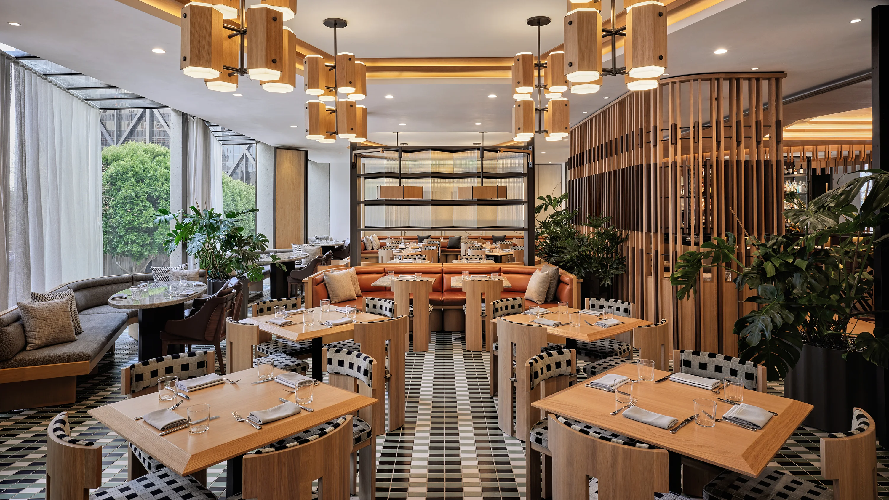 A checkered tile floored restaurant dining room area in the Third Floor Restaurant in the Jay Hotel