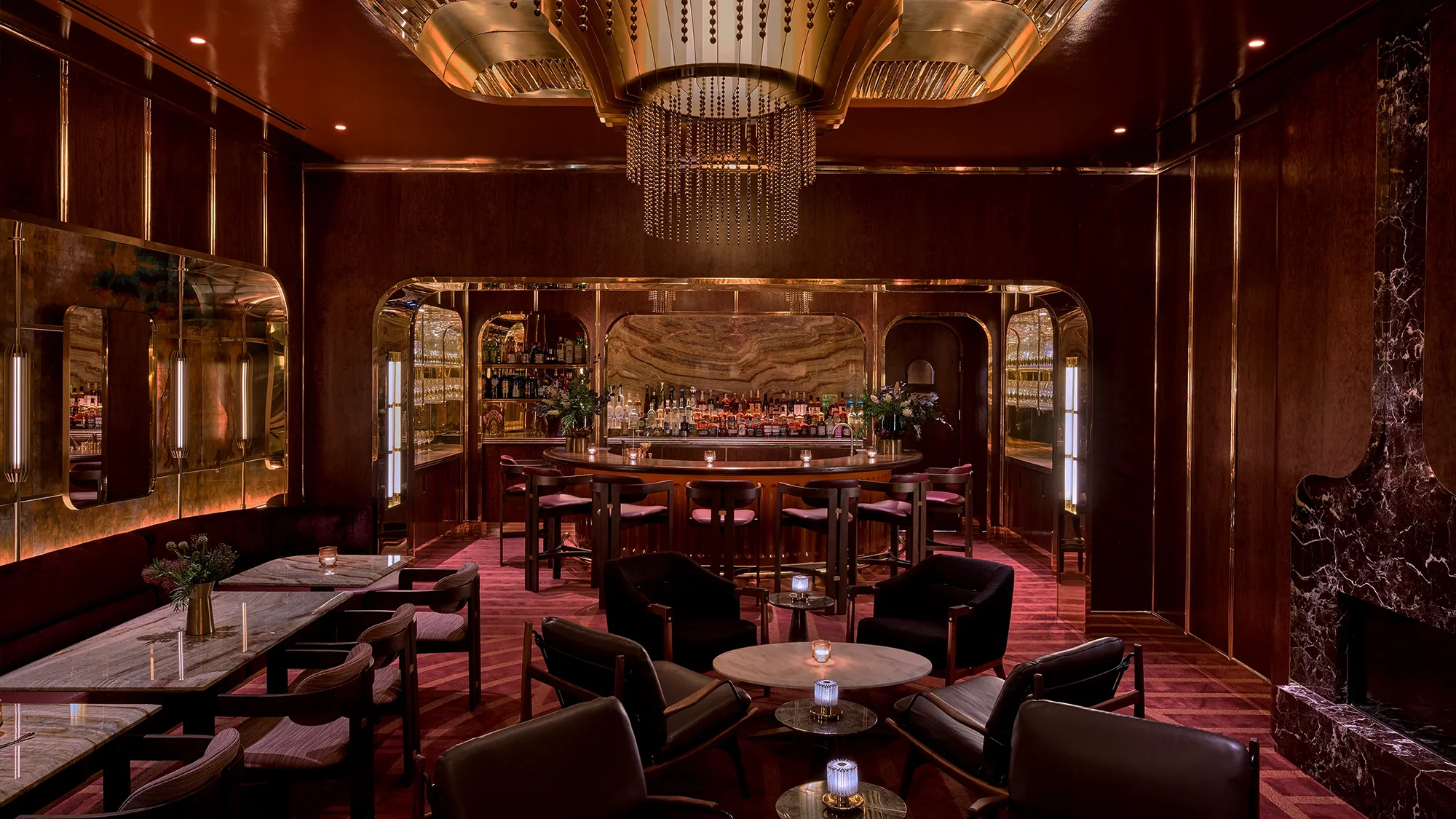A lavish restaurant dining room lit by a stellar chandelier