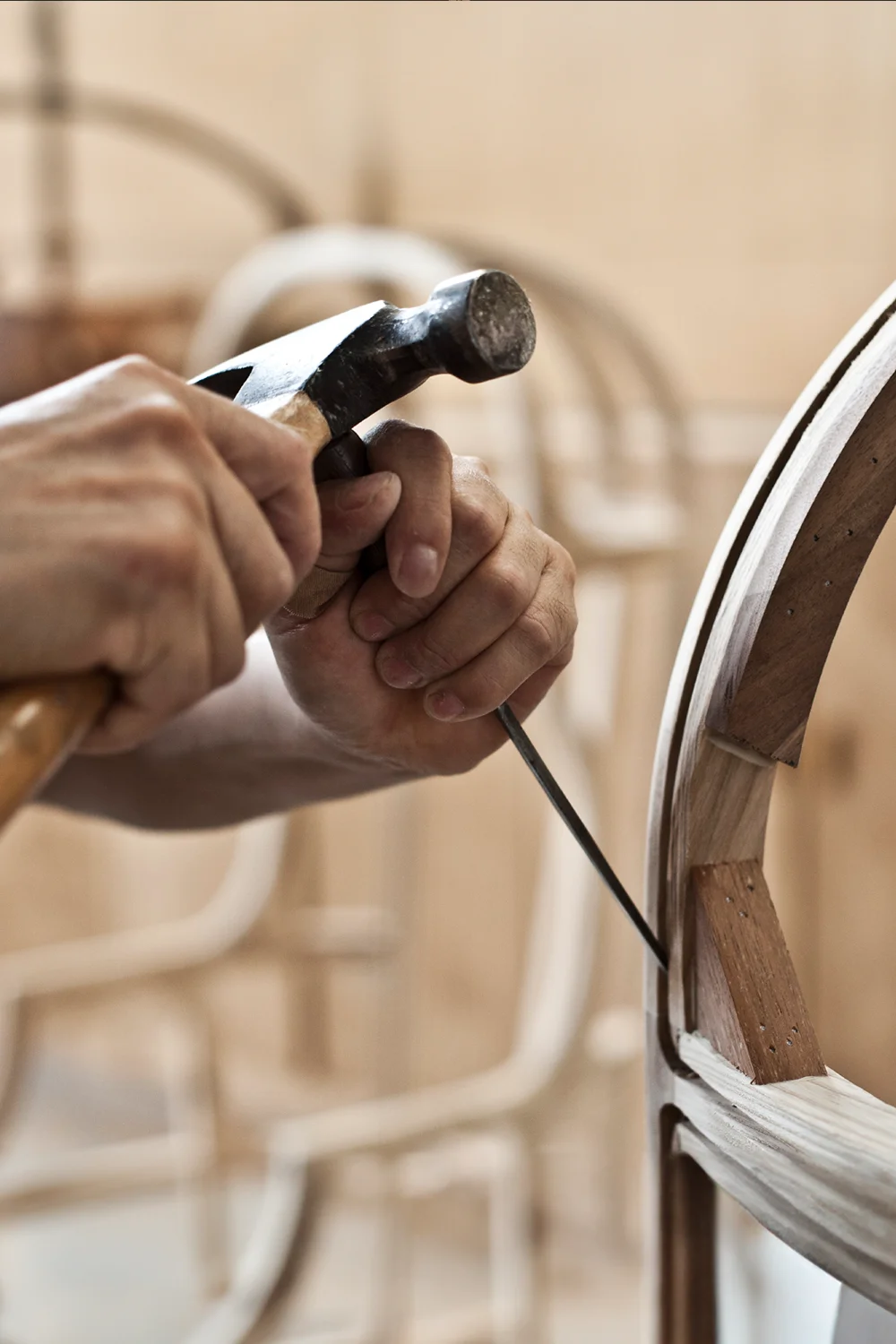 A step in the hand-made furniture design process shaping intricacies into the back of a chair