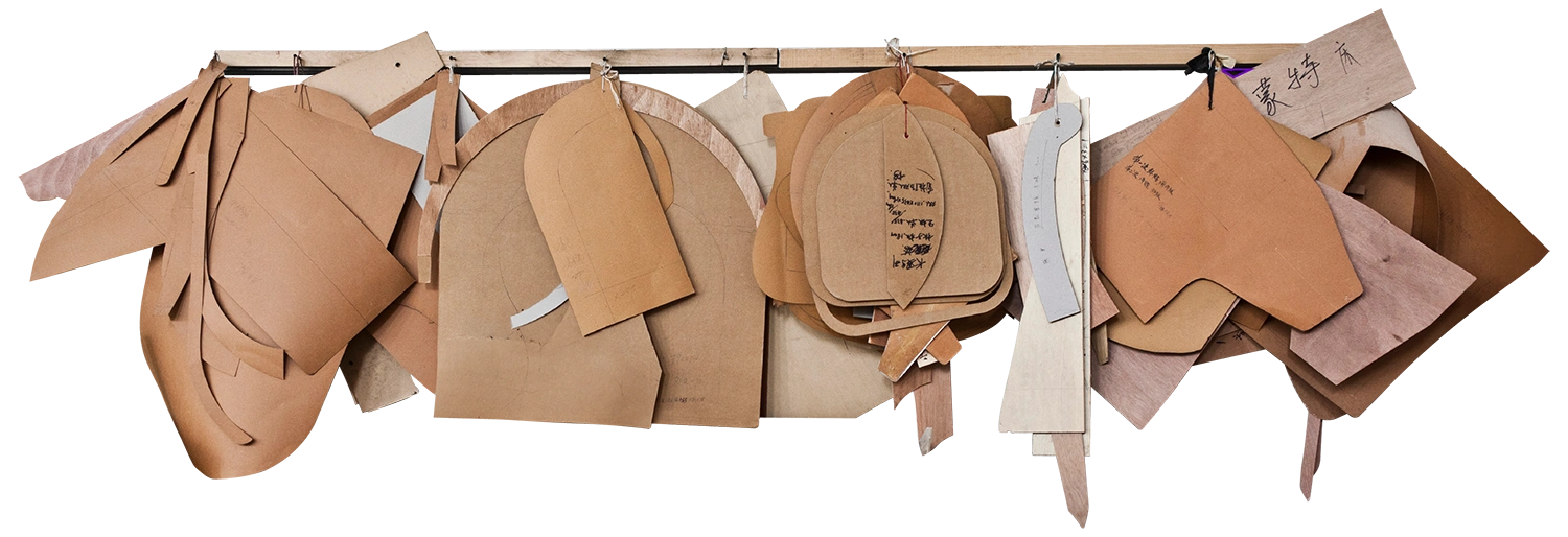 a hangar covered with leather samples hung on it
