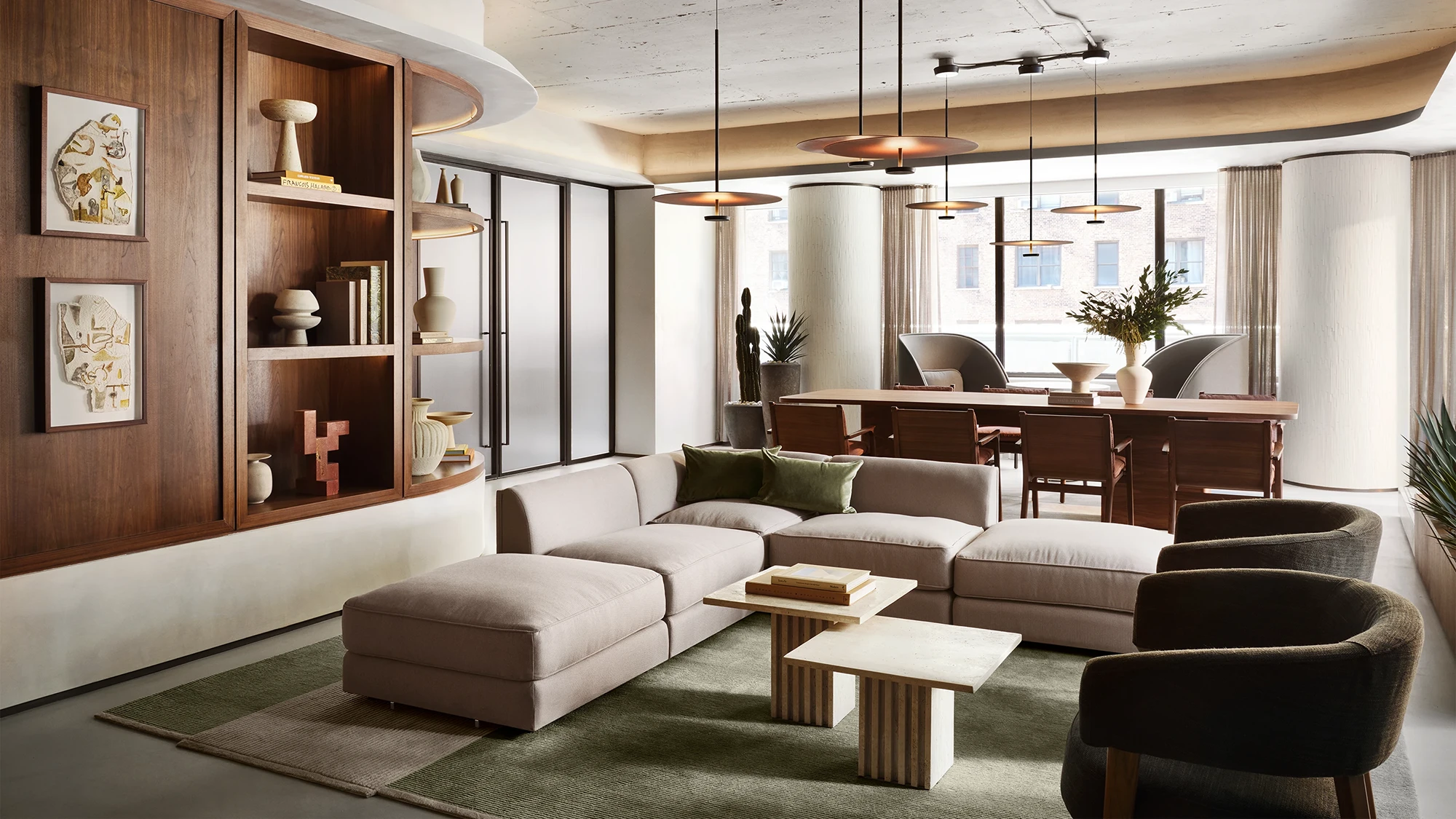 A contemporary lounge seating area featuring well designed sofas and tables   