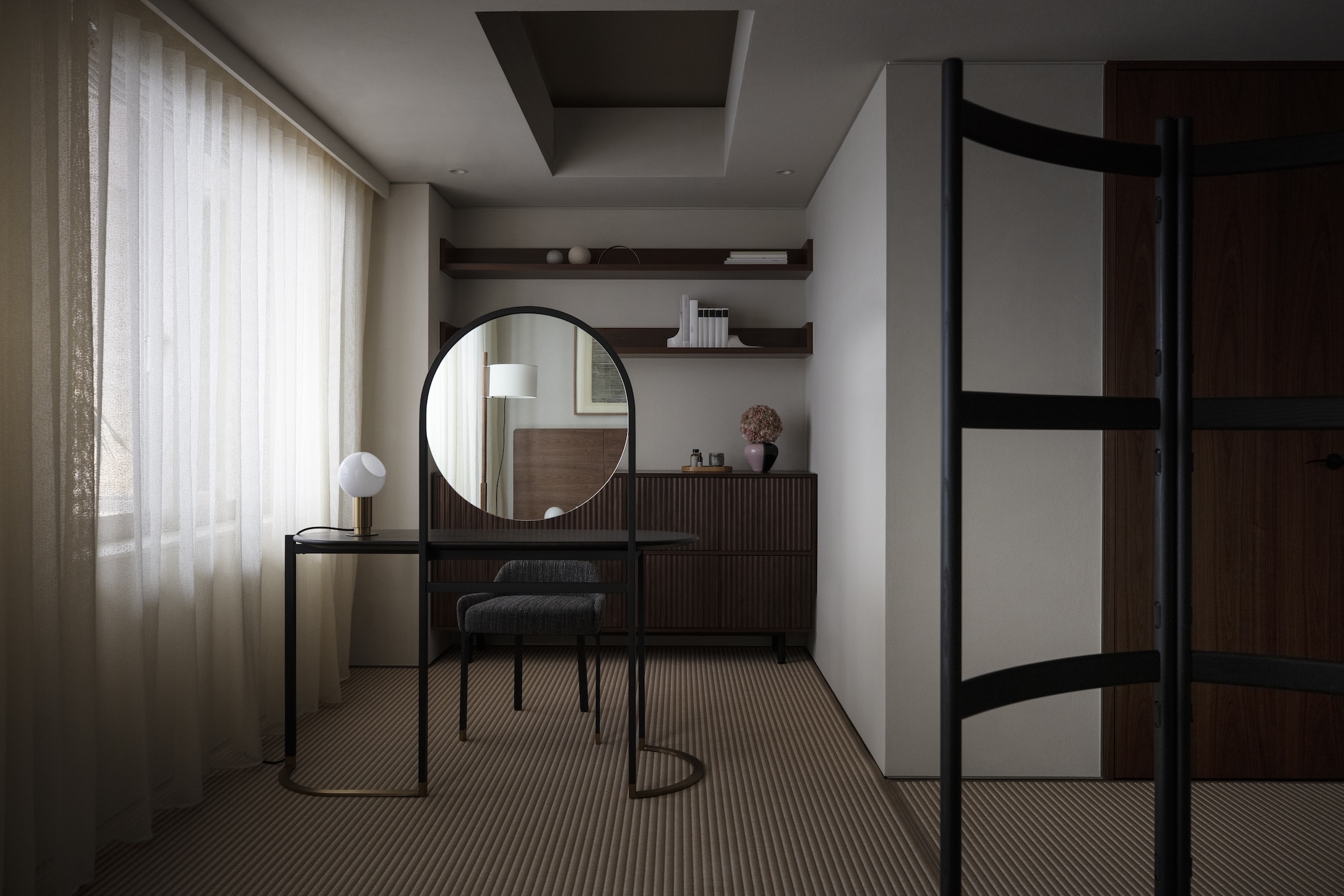 Curtains covering a window lighting a room with a vanity desk, featuring a chair, mirror, and light